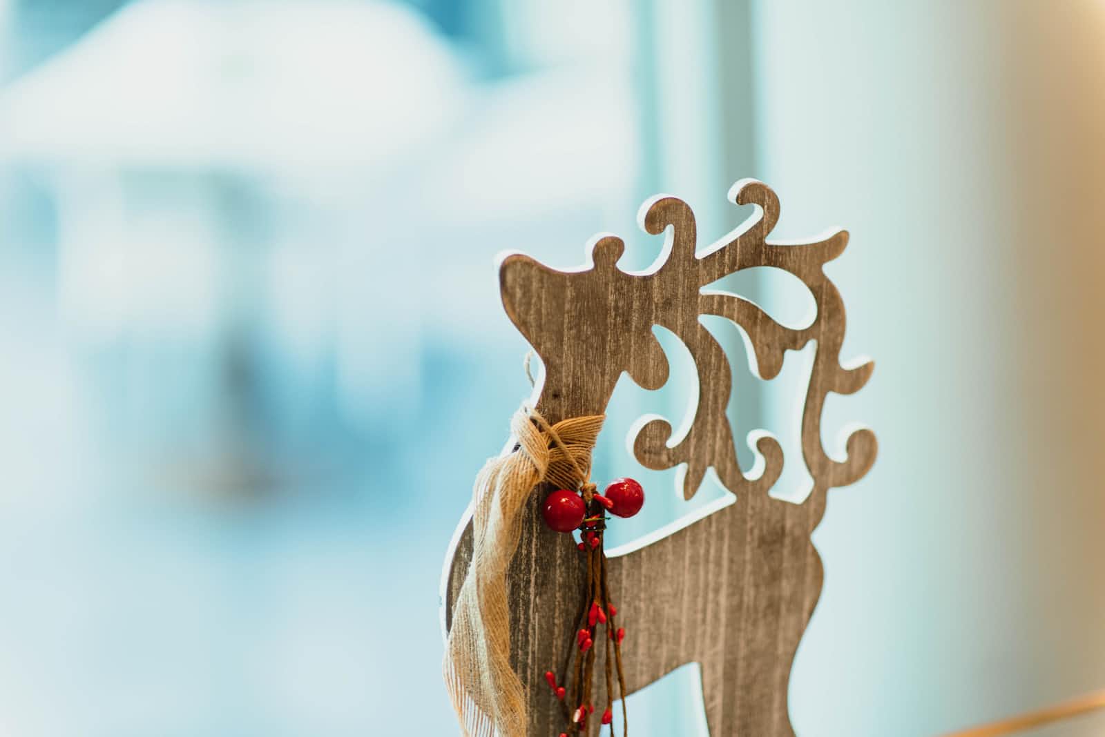 A Christmas reindeer ornament made of wood