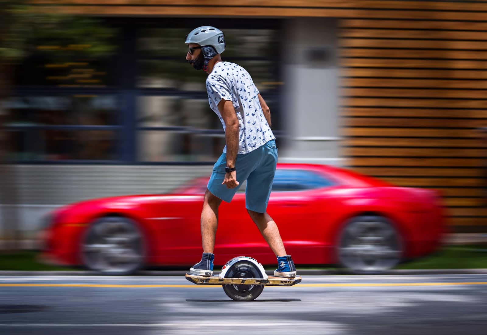 Man moving very fast on an electric unicycle
