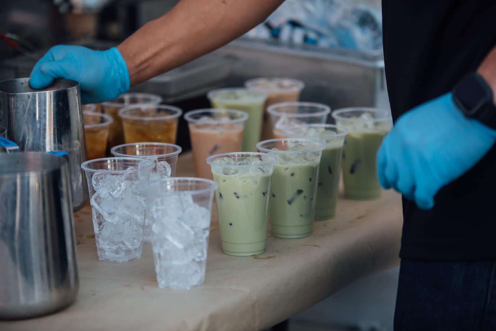 Several types of bubble milk tea in cups with ice
