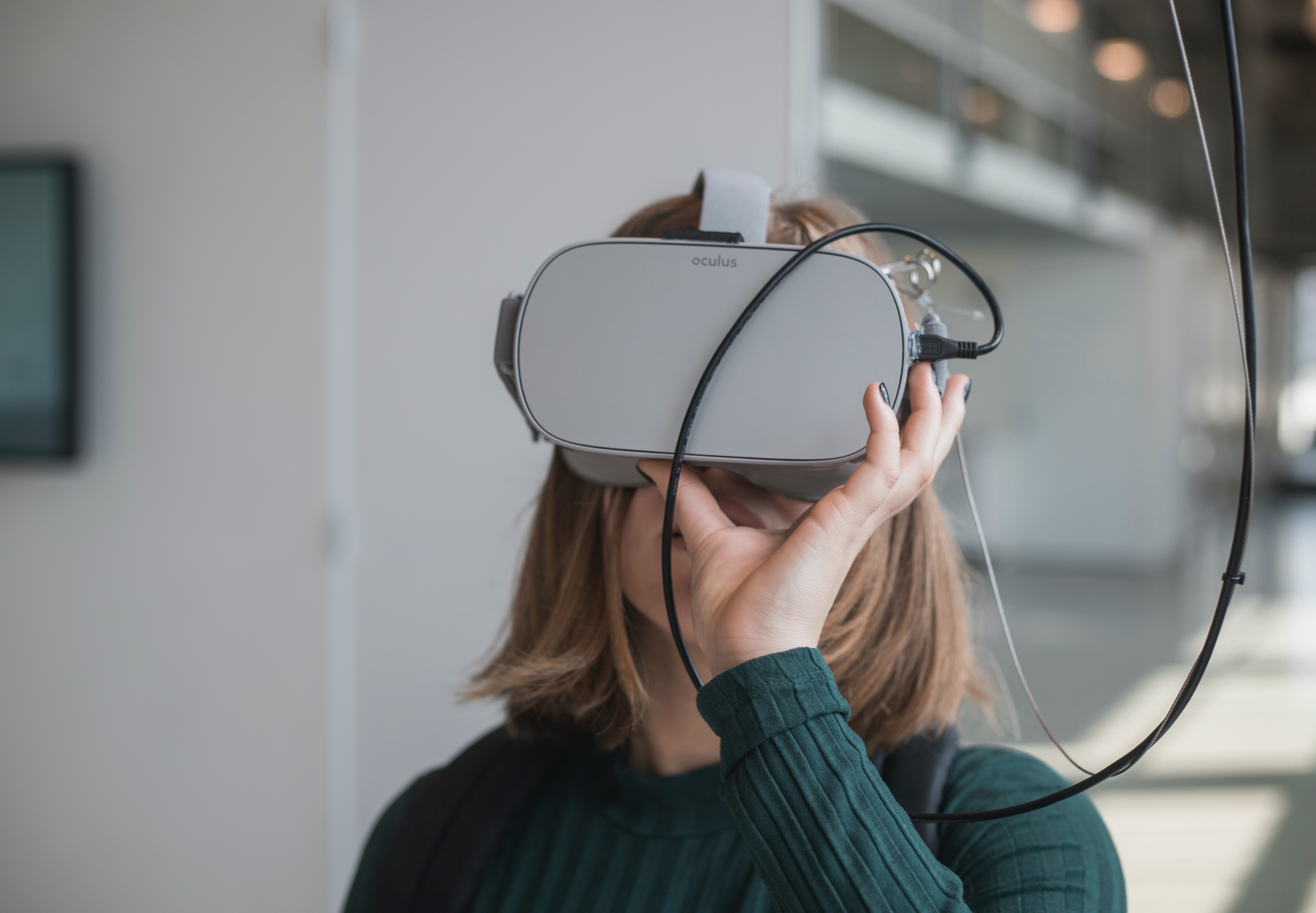 Woman wearing Virtual Reality (VR) headset